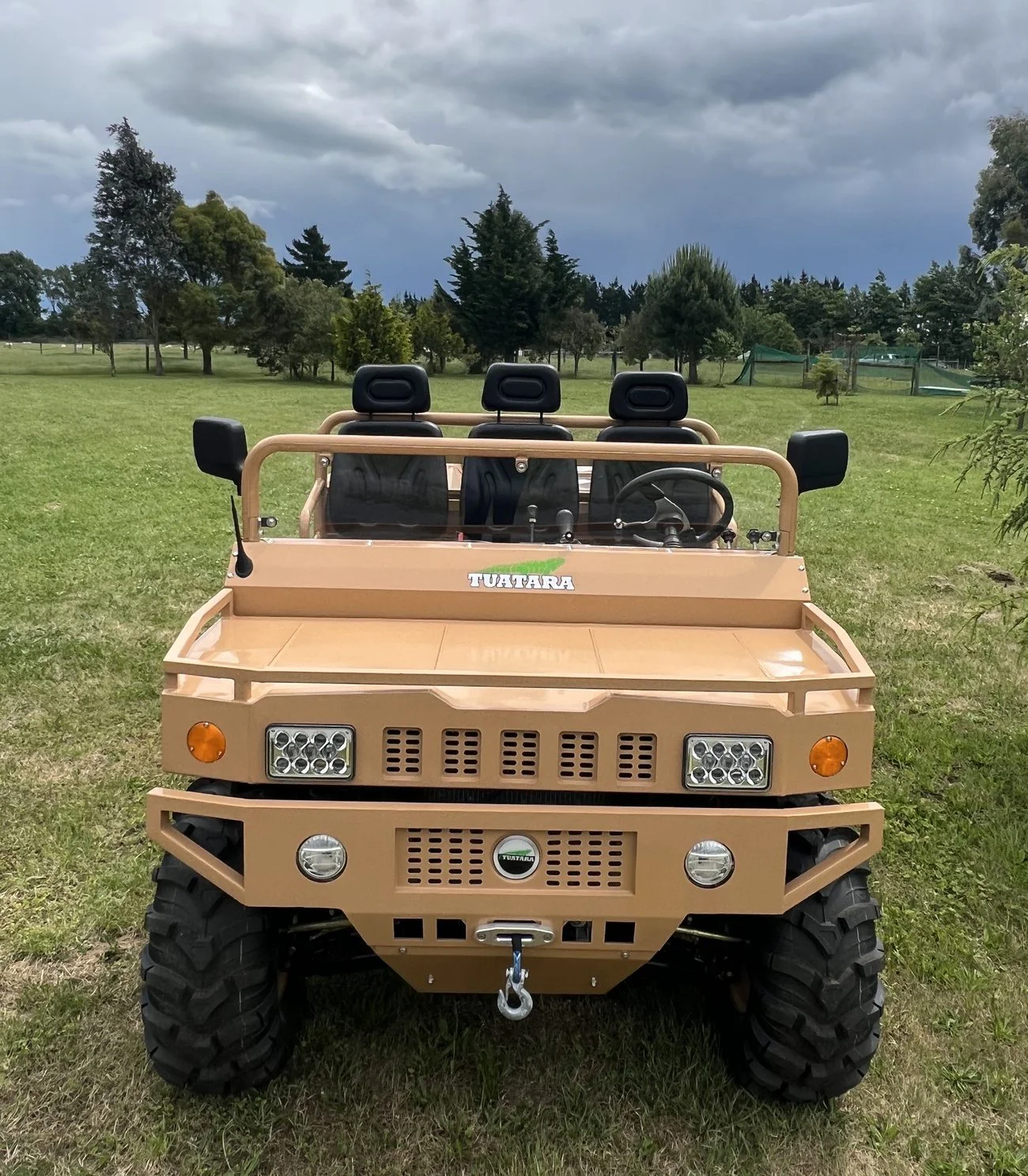 Tuatara Orchardised low-profile electric UTV under an orchard canopy